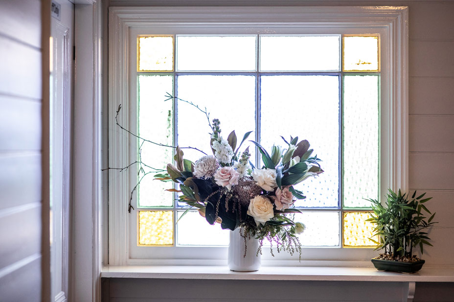 A floral arrangement on the windowsill of Dr Ailin's practice